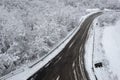 Aerial shot of the Italian Apennines road covered in snow in Vezzolacca, Italy Royalty Free Stock Photo