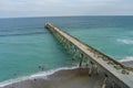 aerial shot of Johnnie Mercer\'s Fishing Pier with vast blue ocean water and people walking along the pier, blue sky Royalty Free Stock Photo