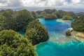 Aerial shot a Limestone islands form a remote lagoon in northern Raja Ampat, Indonesia. Royalty Free Stock Photo