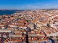 Aerial shot of the Lisbon buildings with tops of red roofs in Alfama, Portugal. Royalty Free Stock Photo