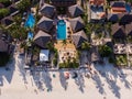 Aerial shot of a luxury hotel on a Beach first line with Palm Trees Garden at evening time in Paje village, Zanzibar