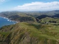 Aerial shot of Makara Wind Farm and Makara beach on a sunny clear day, Wellington, New Zealand Royalty Free Stock Photo