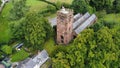 Aerial shot of the medieval St Chads Church church in Winsford England surrounded by green trees