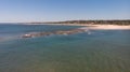 Aerial shot of a mesmerizing seascape in the daytime under the clear sky