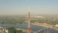 Aerial shot of a mobile telecom tower emitting visualized digital signals, technology related conceptual shot