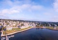 Aerial shot of the Newport Harbor in Rhode Island with ducked boats and a cloudscape Royalty Free Stock Photo