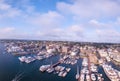 Aerial shot of the Newport Harbor in Rhode Island with ducked boats and a cloudscape Royalty Free Stock Photo