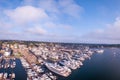 Aerial shot of the Newport Harbor in Rhode Island with ducked boats and a cloudscape Royalty Free Stock Photo