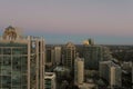 aerial shot of office buildings, skyscrapers in the city skyline at sunset with cars driving on the freeway in Atlanta Georgia Royalty Free Stock Photo