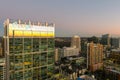 aerial shot of office buildings, skyscrapers in the city skyline at sunset with cars driving on the freeway in Atlanta Georgia