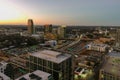 aerial shot of office buildings, skyscrapers in the city skyline at sunset with cars driving on the freeway in Atlanta Georgia Royalty Free Stock Photo