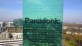 Aerial shot of office skyscraper with Panasonic Corporation logo. Modern office building. Editorial 3D rendering 4K clip