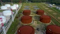 Aerial shot of an oil refinery or nafta barrels and tanks with fuel lines.