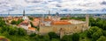 Aerial shot of the old town of Tallinn with orange roofs, churches' spires and the Toompea castle