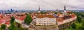 Aerial shot of the old town of Tallinn with orange roofs, churches' spires and the Toompea castle