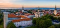 Aerial shot of the old town of Tallinn with orange roofs, churches' spires and the Toompea castle