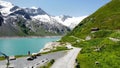 Aerial shot of a path in Kaprun Austria surrounded by greenery waterscape and mountains