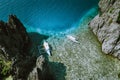 Aerial shot of the Philippines islands in Palawan. Banca boats in the morning shallow water neat to the rocks