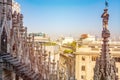 Aerial shot of religious marble statue of Duomo Milan Cathedral from the roof Royalty Free Stock Photo