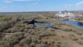 Aerial shot of residential buildings, a river and a lake in a field in Kristianstad city, Sweden Royalty Free Stock Photo