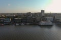 Aerial shot of the restaurants, hotels and office buildings along the riverfront of the Savannah River with ships Royalty Free Stock Photo