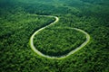 aerial shot of a road in the shape of an infinity sign in a green landscape Royalty Free Stock Photo