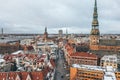 Aerial shot of roofs of an old town with the tower of Dome Cathedral and House of the Blackheads