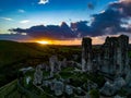 Aerial shot of the ruins of Corfe Castle, Dorset during sunset