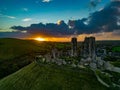 Aerial shot of the ruins of Corfe Castle, Dorset during sunset