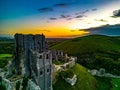 Aerial shot of the ruins of Corfe Castle, Dorset during sunset Royalty Free Stock Photo