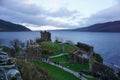 Aerial shot of the ruins of Urquhart Castle, Edinburgh under cloudy sky