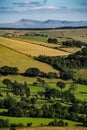 Aerial shot of rural farmland with hills of green and yellow foliage in Brecon Beacons, Wales, UK Royalty Free Stock Photo