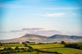 Aerial shot of rural farmland with hills of green and yellow foliage in Brecon Beacons, Wales, UK Royalty Free Stock Photo