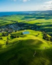 Aerial shot of a rural landscape featuring a lake and green fields. Toora, Victoria, Australia. Royalty Free Stock Photo