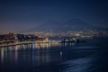 Aerial shot of the sea with Naples night panorama a Vesuvius in Italy Royalty Free Stock Photo