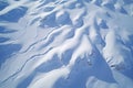 aerial shot of ski tracks on a snowy mountain slope Royalty Free Stock Photo