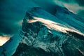 Aerial shot of snowy rocky mountains Royalty Free Stock Photo