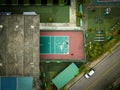 Aerial shot some people playing tennis in an old playground against the wall called fronton. Royalty Free Stock Photo