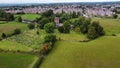 Aerial shot of the St Chads Church church in Winsford surrounded by the green trees and the town