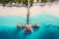 Aerial shot of the Stilt hut with palm thatch roof washed with turquoise Indian ocean waves on the white sand sandbank beach on Royalty Free Stock Photo