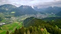 Aerial shot of successive forested hills, valleys and a small town, Bludenz, Vorarlberg, Austria