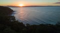 Aerial shot of the sun setting above the coast line around Noosa in the Sunshine cost Royalty Free Stock Photo