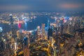 Aerial shot a Thousand of skyscraper on two side of Victoria Harbour of Hong Kong. View from the Peak at night. Royalty Free Stock Photo