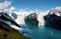 Aerial shot of three majestic glaciers calving into Prince William Sound.