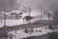 Aerial shot of a train going near the snowy Bad Goisern, Austria Royalty Free Stock Photo