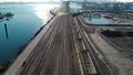 Aerial shot of a the trainyard and port facility with Downtown Vancouver in the background.