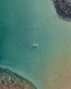 Aerial shot of two boats floating on light blue water Royalty Free Stock Photo