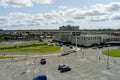 aerial shot of Union Passenger Terminal train station with cars and trucks driving on the highway, blue sky and clouds