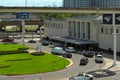 aerial shot of Union Passenger Terminal train station with cars and trucks driving on the highway, blue sky and clouds