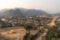 Aerial shot of Vang Vieng and hot air balloons